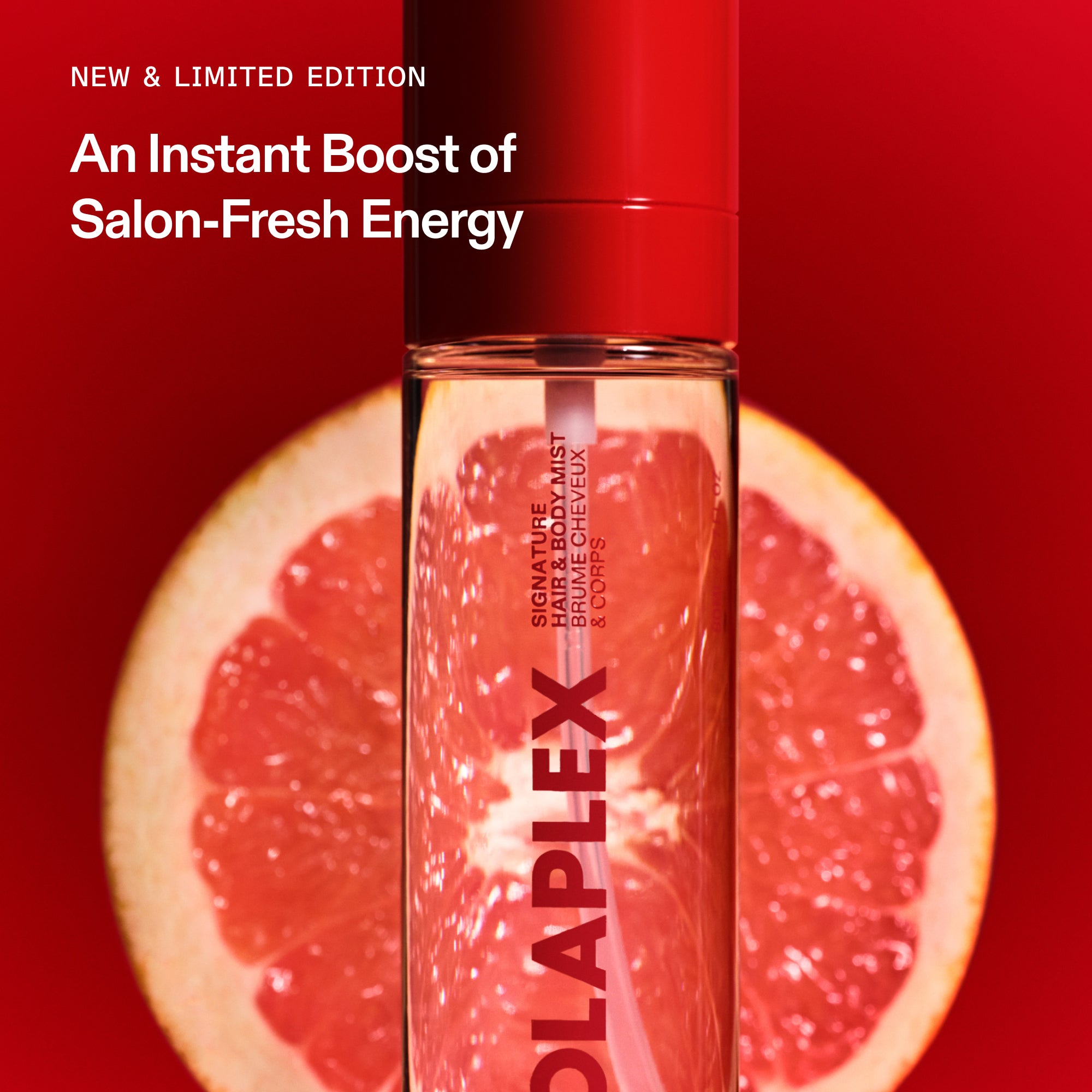 An OLAPLEX fragrance mist bottle in front of a sliced grapefruit on a bold red background. Promotional text reads: "NEW & LIMITED EDITION. An Instant Boost of Salon-Fresh Energy.