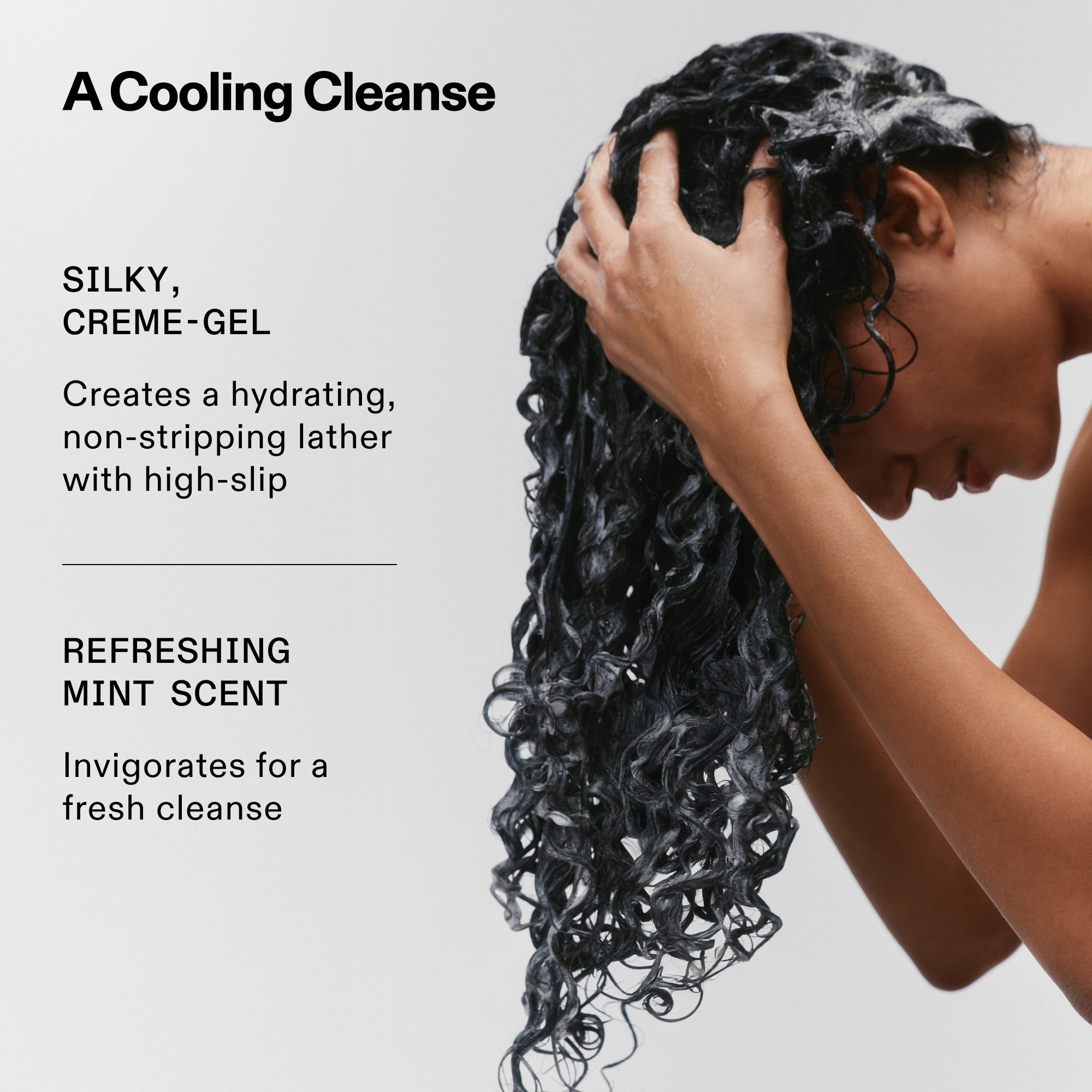A model with long, curly hair washing with Nº.4CURL BOND SHAPER™ shampoo to show a rich lather. Text highlights: A Cooling Cleanse with a silky, creme-gel texture that creates a hydrating, non-stripping lather with high-slip; and a refreshing mint scent that invigorates.