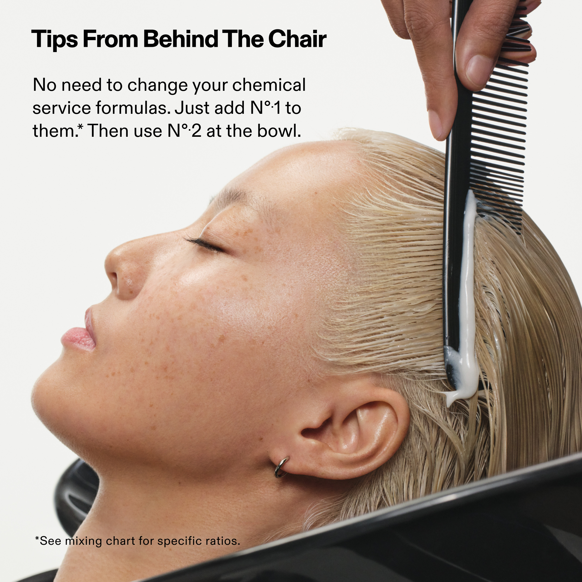 Tips From Behind The Chair
No need to change your chemical service formulas. Just add Nº1 to them. Then use Nº2 at the bowl.

*See mixing chart for specific ratios.

Model on salon sink with stylist combing through Nº.2 BOND PERFECTOR (525mL)